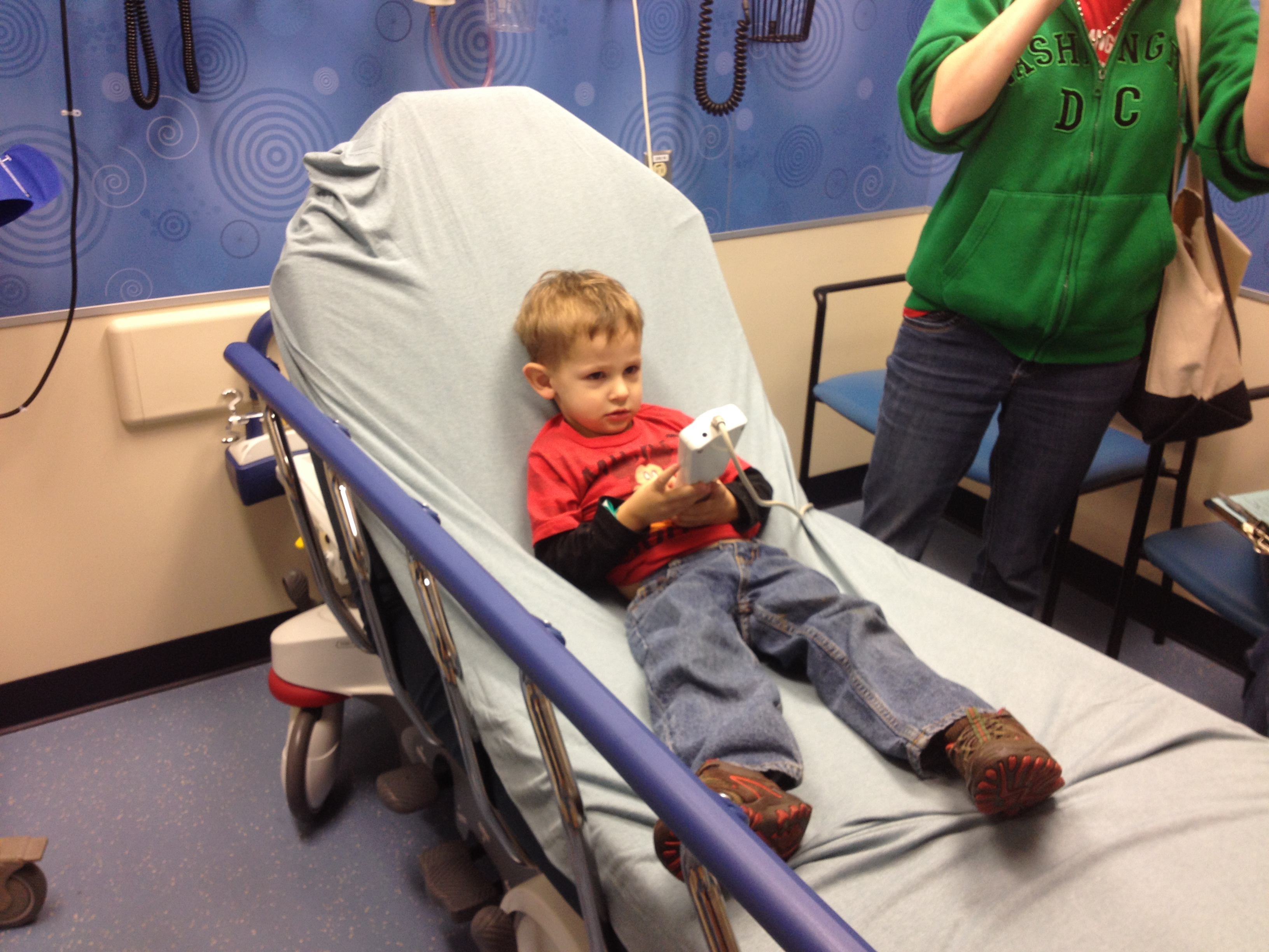 Luke at hospital with the remote.